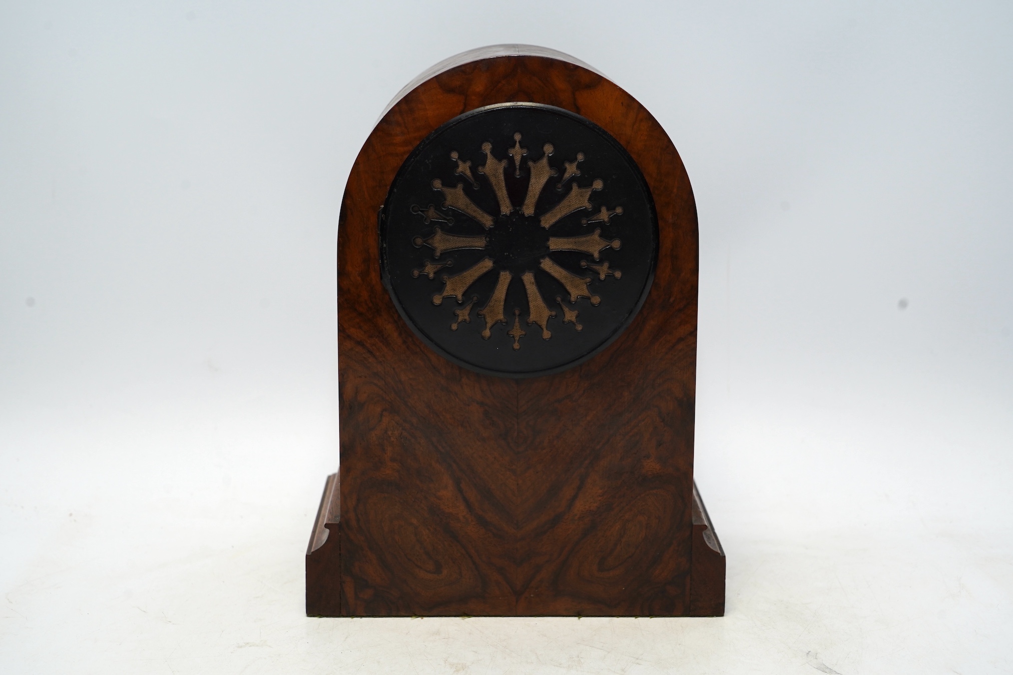 An Edwardian mantel clock with Arabic dial and applied plaque, 25cm high. Condition - fair to good, some cracking to the wood